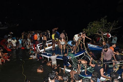 Rescue workers at the site of the boat mishap at Tanur in Malappuram district of Kerala