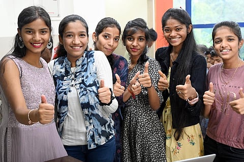 Students rejoice after the SSLC results were declared in Bengaluru. (Photo| Nagaraja Gadekal, EPS) 