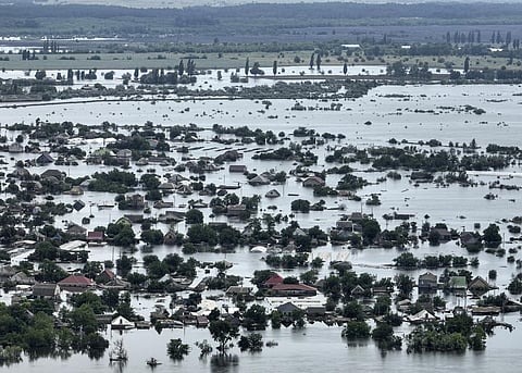 Houses are seen underwater in the flooded town of Oleshky, Ukraine, Saturday, June 10, 2023.  (Photo | AP)
