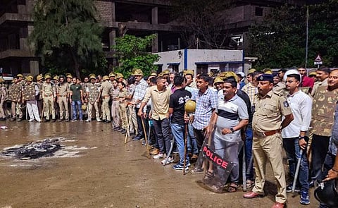 Security personnel deployed after clashes erupted over Junagadh Municipal Corporation's demolition notice to a mosque situated near the Majewadi Gate. (Photo | PTI)