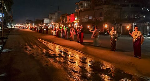 Women form a human chain to protest against the ethnic violence between the Meitei and Kuki community in Manipur (File Photo | PTI)