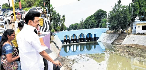 Chief Minister M K Stalin on Monday inspects a stretch of Odampokki river near Tiruvarur from which water hyacinth was removed to allow free flow of irrigation water | express