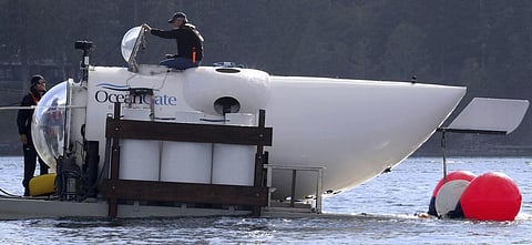 OceanGate CEO Stockton Rush emerges from the hatch atop the OceanGate submarine Cyclops 1 in the San Juan Islands, Wash., on Sept. 12, 2018.  (Photo | AP)