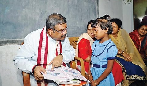 Pradhan with students of Government Primary School at Handidhua in Angul district