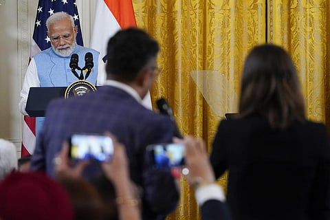 Prime Minister Narendra Modi listens to a reporter's question during a news conference with US President Joe Biden in the East Room of the White House, June 22, 2023. (Photo | AP)