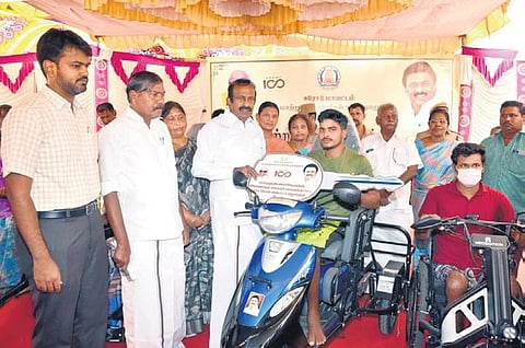 Minister S Muthuswamy distributing assistance to  145 differently abled beneficiaries at the Erode collectorate on Monday | Express