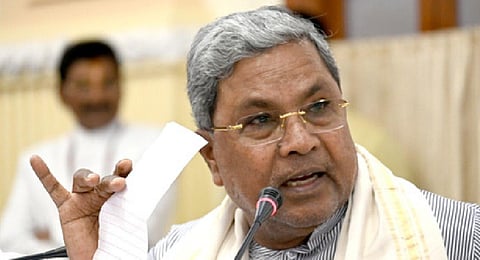 Siddaramiah announcing the the five guarantee scheme implementations and process during press meet after the cabinet meeting on Friday in Bengaluru.(Photo | Express)