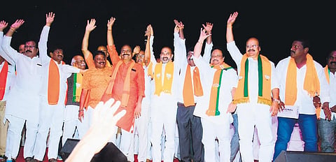 BJP State president Bandi Sanjay, AP Jithender Reddy and other leaders wave to  the people at a public meeting in Athmakur on Thursday