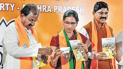 ​  Union Minister Bharati Pravin Pawar releases a booklet on the nine-year rule of Prime Minister Narendra Modi in Vijayawada on Wednesday I Prasant Madugula  ​