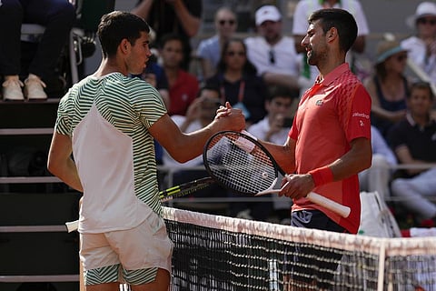Novak Djokovic (R) is congratulated by Carlos Alcaraz after the Serbian won the semifinal match of the French Open at the Roland Garros stadium in Paris, Friday, June 9, 2023. (Photo | AP)