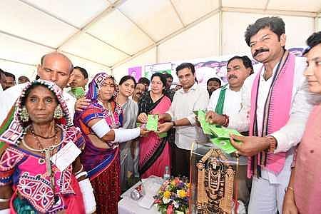 MAUD Minister KT Rama Rao distributes pattas to podu farmers on Friday