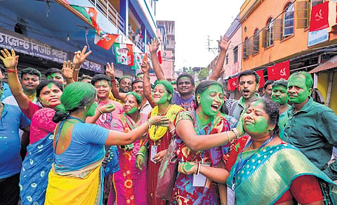Trinamool Congress workers celebrate the party’s lead during the counting of votes of West Bengal panchayat polls in Howrah on Tuesday | PTI