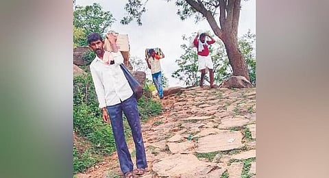 ​  With no transport, residents have to carry groceries to their villages  ​