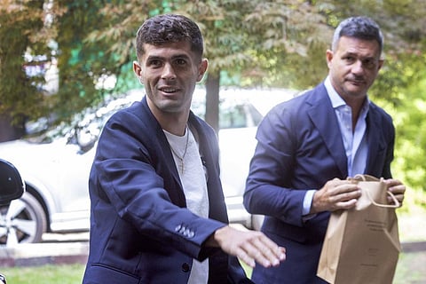 United States soccer player Christian Pulisic, front, waves as he arrives in Milan, Italy, Wednesday, July 12, 2023, for medical tests at Italian Serie A soccer team AC Milan. (Photo | AP)