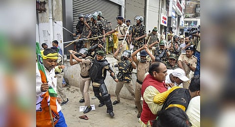 Security personnel baton charge BJP supporters during their protest march towards Vidhan Sabha in support of demands of teachers' job aspirants. (Photo | PTI)