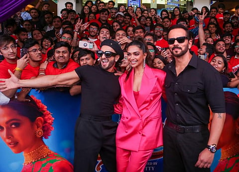 Actors Ranveer Singh and Deepika Padukone and director Rohit Shetty pose for photos during the song launch of 'Cirkus'. (Photo | PTI)
