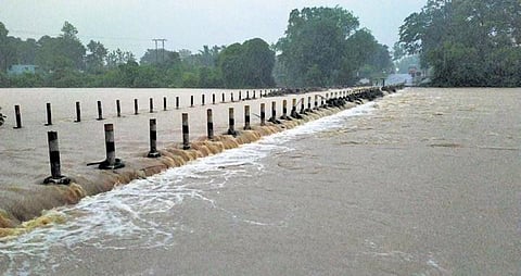 Rainwater flowing over the low-lying bridge at Potteru in Malkangiri district | Express