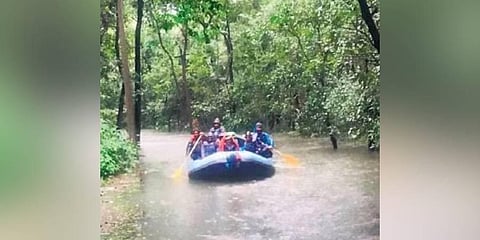 ​  Residents of Kali Tiger Reserve being ferried in a raft following heavy rainfall  ​