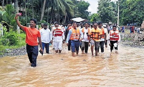 Collector Himanshu Shukla, along with other district officials, inspected inundated villages in Ainavilli and interacted with the people on Sunday | Express