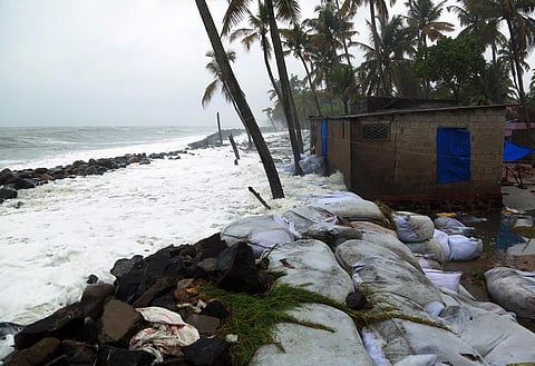 A house at Kannamali develops cracks as tidal waves batter its wall. (Photo | T P Sooraj, EPS)