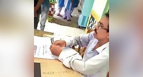 ​  Screen grab of the video showing Behera taking money | EXPRESS  ​