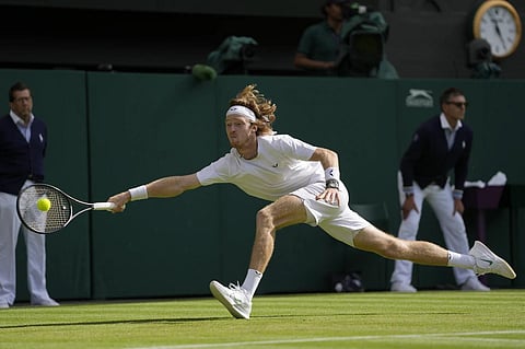 Russia's  Andrey Rublev returns to Kazakhstan's Alexander Bublik at Wimbledon, July 9, 2023. (Photo | AP)