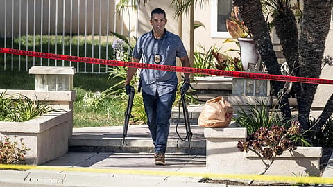 Investigators remove firearms from a house in the 8500 block of E.Canyon Vista Dr. in Aneheim, Calif., on Aug 4, 2023. (Photo | AP)