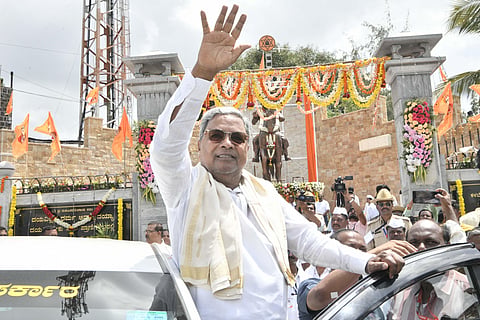 Karnataka CM Siddaramaiah arrives to unveil a statue of social reformer Basaveshwara in Athani on Friday. (Photo  Express)