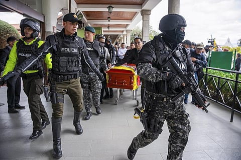 Police escort the coffin carrying the remains of slain presidential candidate Fernando Villavicencio at the Camposanto Monteolivo cemetery, in Quito, Ecuador, Aug. 11, 2023. (AP)