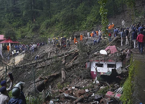 Rescuers remove mud and debris as they search for people feared trapped after a landslide near a temple on the outskirts of Shimla, Himachal Pradesh, Monday, Aug.14, 2023. (Photo | AP)