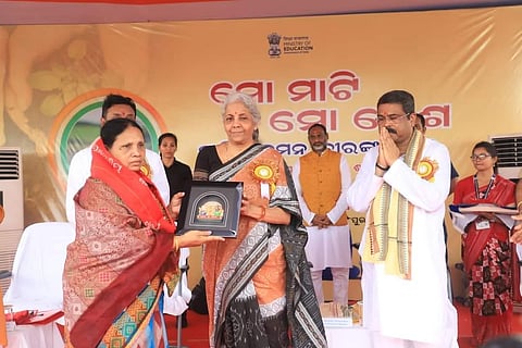 Union Ministers Sitharaman and Pradhan felicitating a martyr’s family member in Puri on Thursday | Express