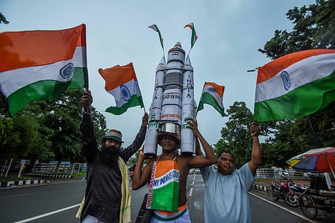 A man carries a model of Chandrayaan-3 at Mahatma Gandhi Marg in  Bhubaneswar, Odisha. (Photo | Debadatta Mallick, EPS)