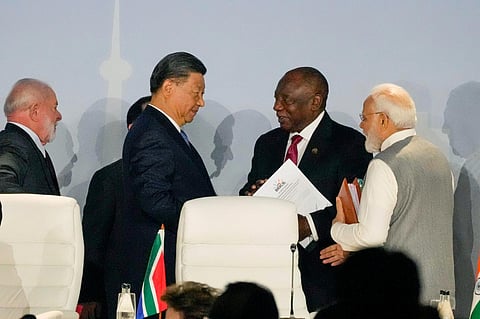 South African President Cyril Ramaphosa, centre right speaks to China's President Xi Jinping as President of Brazil Luiz Inacio Lula, left, and Prime Minister of India Narendra Modi look on. (PTI)