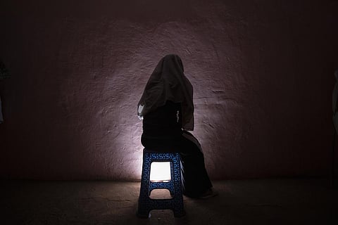 A Tigrayan refugee rape victim who fled the conflict in Ethiopia's Tigray sits for a portrait in eastern Sudan. (AP)