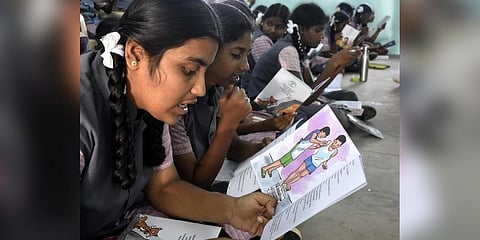 Students from Government Girls Higher Secondary School in Ashokapuram in Coimbatore read books as part of the reading movement. (Photo | S Senbagapandiyan)