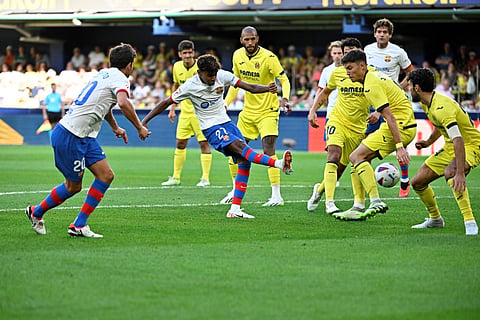 Barcelona's Spanish forward #27 Lamine Yamal kicks the ball during the Spanish Liga football match between Villarreal CF and FC Barcelona. (Photo | AFP)