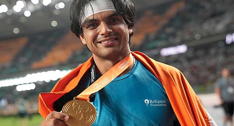 Neeraj Chopra poses after winning the gold medal in the Men's javelin throw final during the World Athletics Championships in Budapest, Hungary, Sunday, Aug. 27, 2023. (AP)