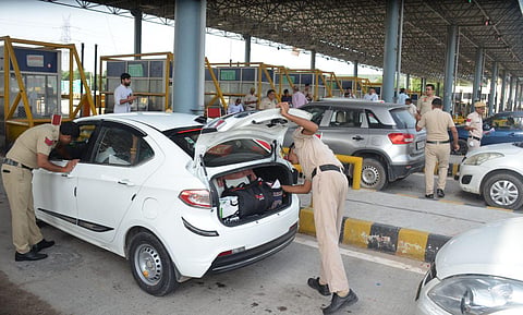 Police check vehicles ahead of a rally of Hindu organisations to be taken out in Nuh, weeks after violence in the region, at Bhondsi toll plaza in Gurugram, Monday, Aug. 28, 2023. (Photo | PTI)