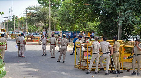 Police personnel stand guard ahead of a rally of Hindu organisations to be taken out in Nuh, weeks after violence in the region, in Gurugram district, Monday, Aug. 28, 2023.  (Photo | PTI)