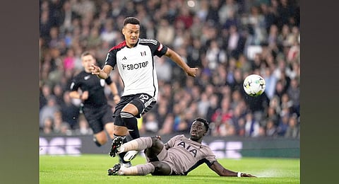 Fulham's Rodrigo Muniz (left) and Tottenham Hotspur's Davinson Sanchez battle for the ball during the Carabao Cup second-round football match. (Photo | AP)
