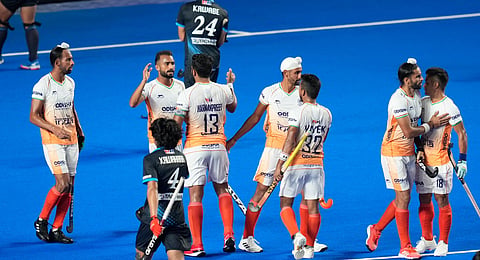 Indian captain Harmanpreet Singh celebrates with teammates after scoring a goal against Japan during their Asian Champions Trophy match (Photo | PTI)