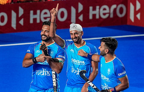 Indian men's hockey team player Mandeep Singh celebrates with teammates after scoring a goal against China during an Asian Champions Trophy 2023 match (Photo | PTI)