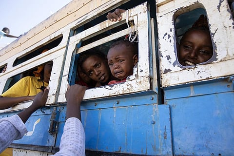 FILE - Refugees who fled the conflict in Ethiopia's Tigray region ride a bus going to the Village 8 temporary shelter, near the Sudan-Ethiopia border, in Hamdayet, on Dec. 1, 2020. (Photo | AP)