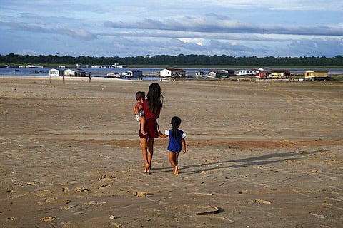Representational Image: Children walk in an area impacted by the drought near the Solimoes River, in Tefe, Amazonas state, Brazil, October 19, 2022. (Photo | AP)