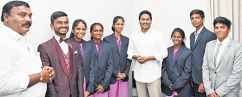 Chief Minister YS Jagan Mohan Reddy with the alumni of APSWREIS, who got selected for KL-YES, at his camp office in Tadepalli on Thursday | Express