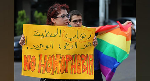 Supporters of the LGBTQ+ community attend a sit-in to protest the ongoing criminalization of homosexuality and arbitrary arrests in front of Hobeich police station in Beirut. (File photo | AP)