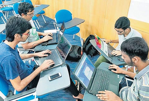 Techies brainstorming at a Hackathon,