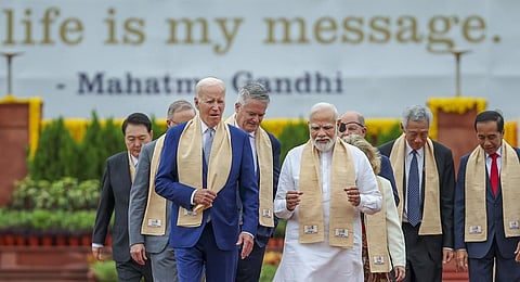 FILE - PM Narendra Modi with US President Joe Biden and other G20 leaders arrives to pay homage at Mahatma Gandhi's memorial Rajghat on the final day of the G20 Summit. (Photo | PTI)
