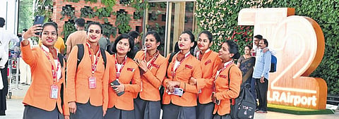 Clockwise from top: Kempegowda International Airport staff take a selfie at Terminal 2 on the inaugural day of international operations.