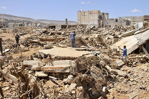 Floodwaters washed down Wadi Derna, a valley that cuts through the city, crashing through buildings and washing people out to sea.  (Photo | AP)